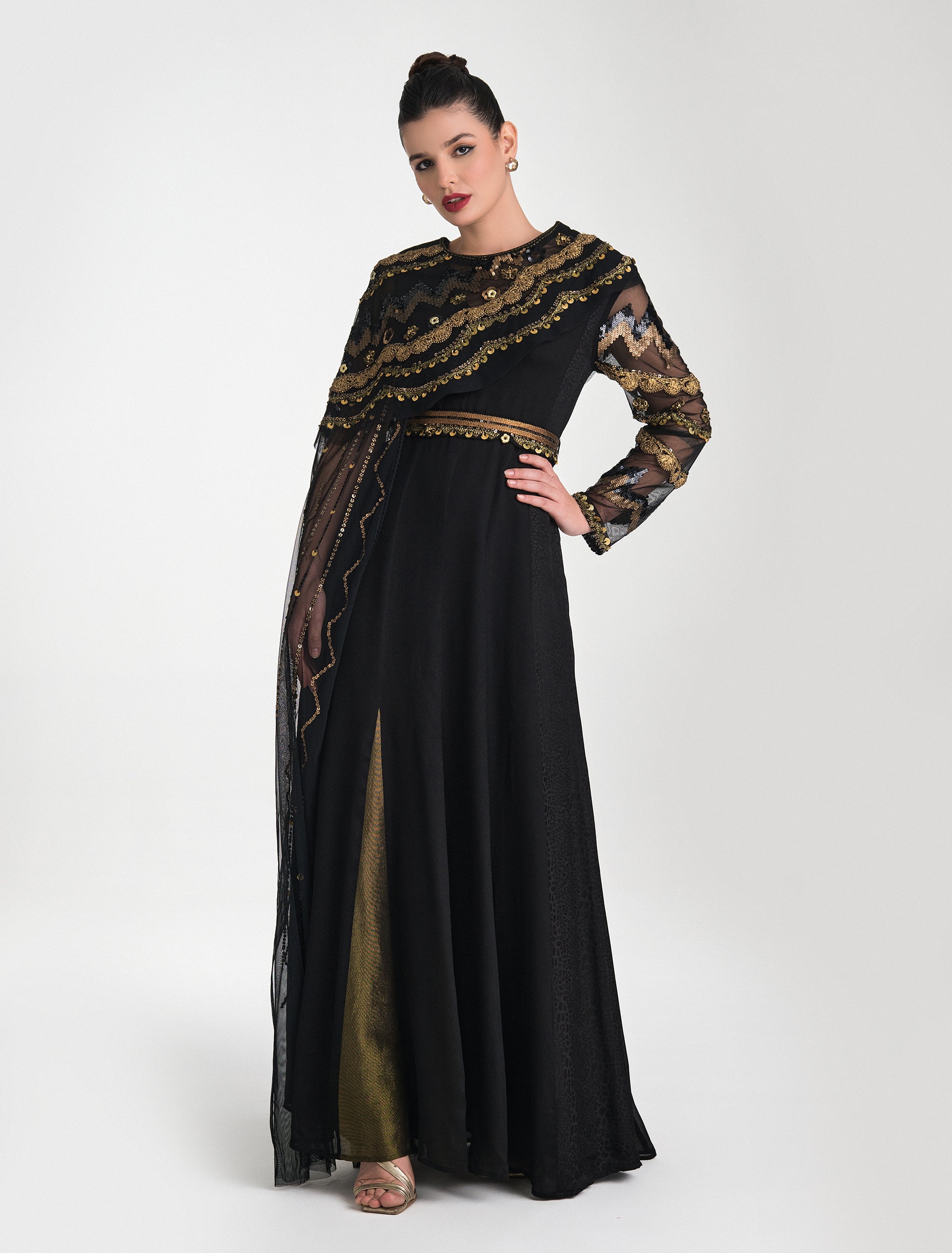 Shop Now: A Striking Black and Gold Dress with Distinctive Embroidery Accents and a Cape! Shop Now: A Striking Black and Gold Dress with Distinctive Embroidery Accents and a Cape!