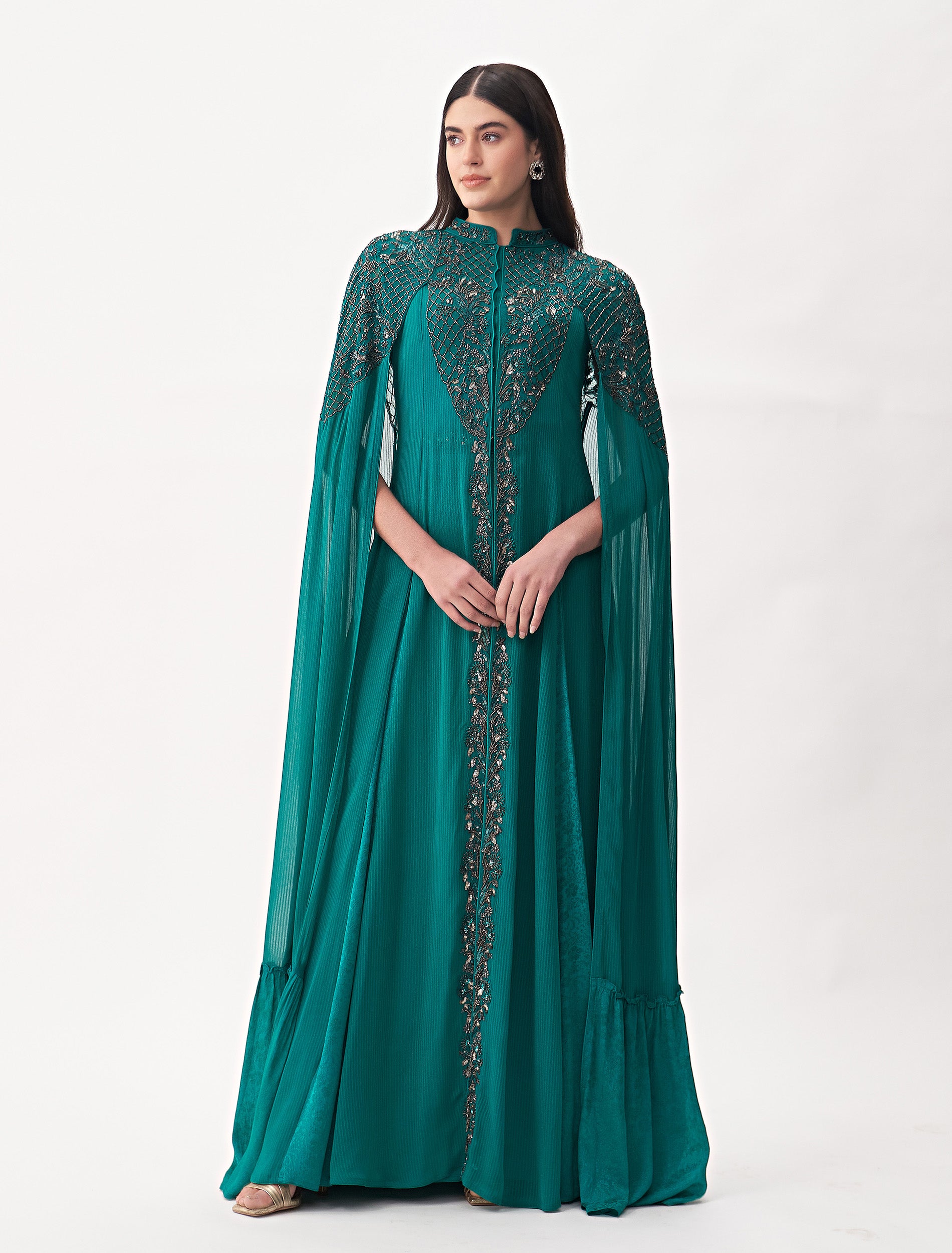A Green Maxi Dress with a Long Cape Design, Perfect for Special Occasions. A Green Maxi Dress with a Long Cape Design, Perfect for Special Occasions.