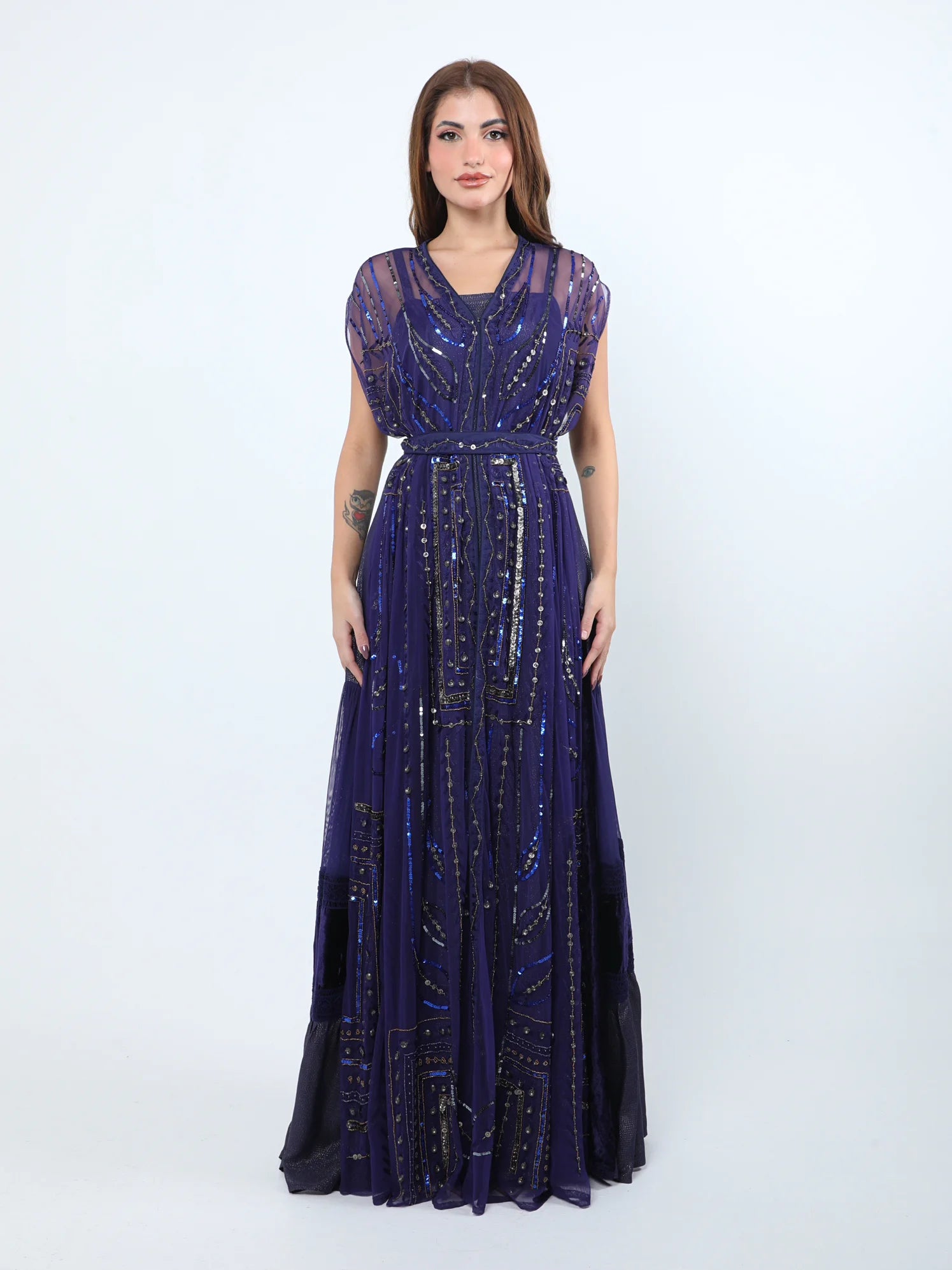 Olive-green sleeveless dress with hand embroidery and a loose cut Olive-green sleeveless dress with hand embroidery and a loose cut