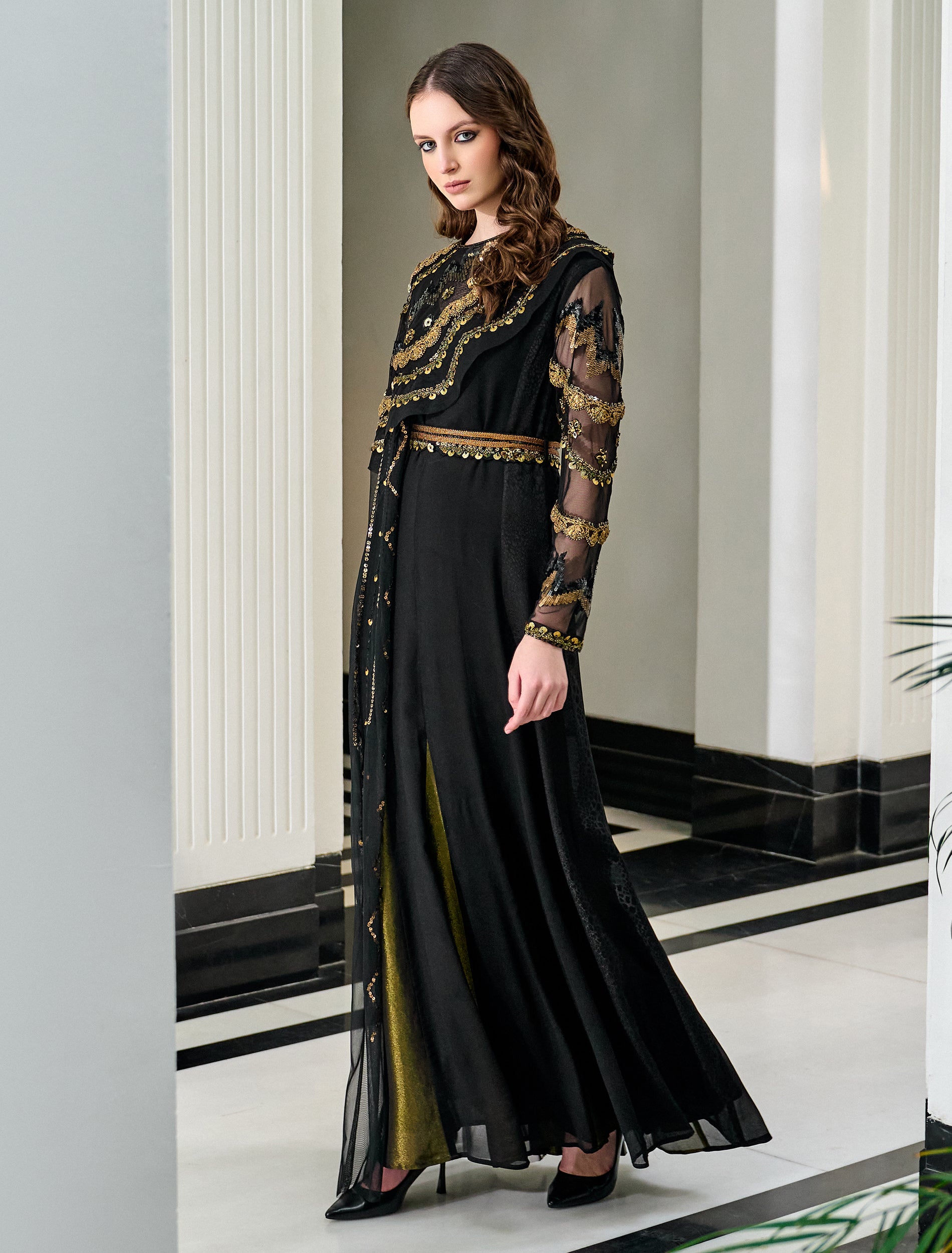 Shop Now: A Striking Black and Gold Dress with Distinctive Embroidery Accents and a Cape! Shop Now: A Striking Black and Gold Dress with Distinctive Embroidery Accents and a Cape!