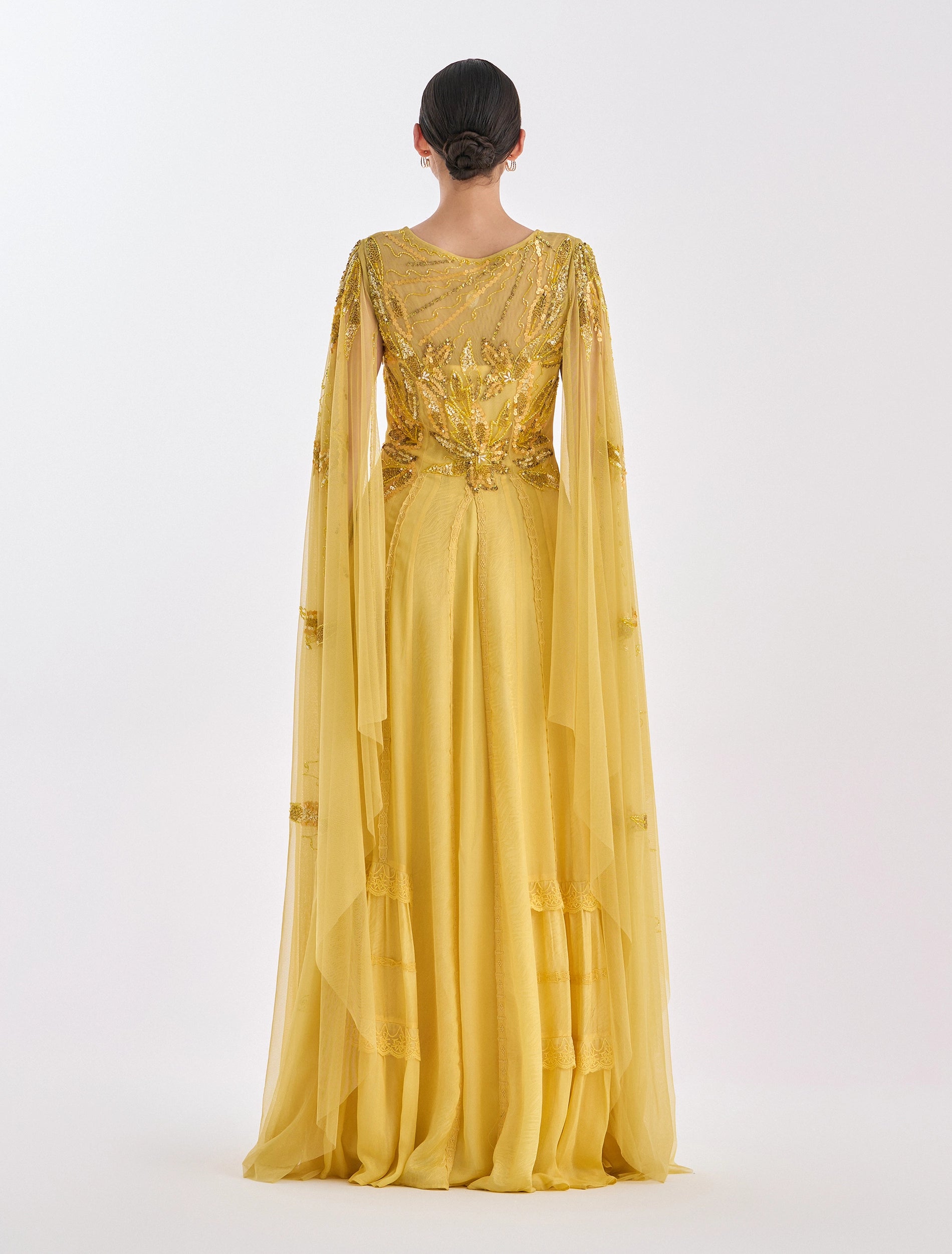 Long yellow dress with a cape & gold embroidery
