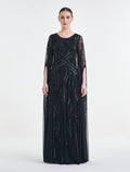 فستان ناعم سهرة أسود أنيق بأكمام كاب مفتوحة لامعة
Elegant black dress for evenings with shimmering open cape sleeves