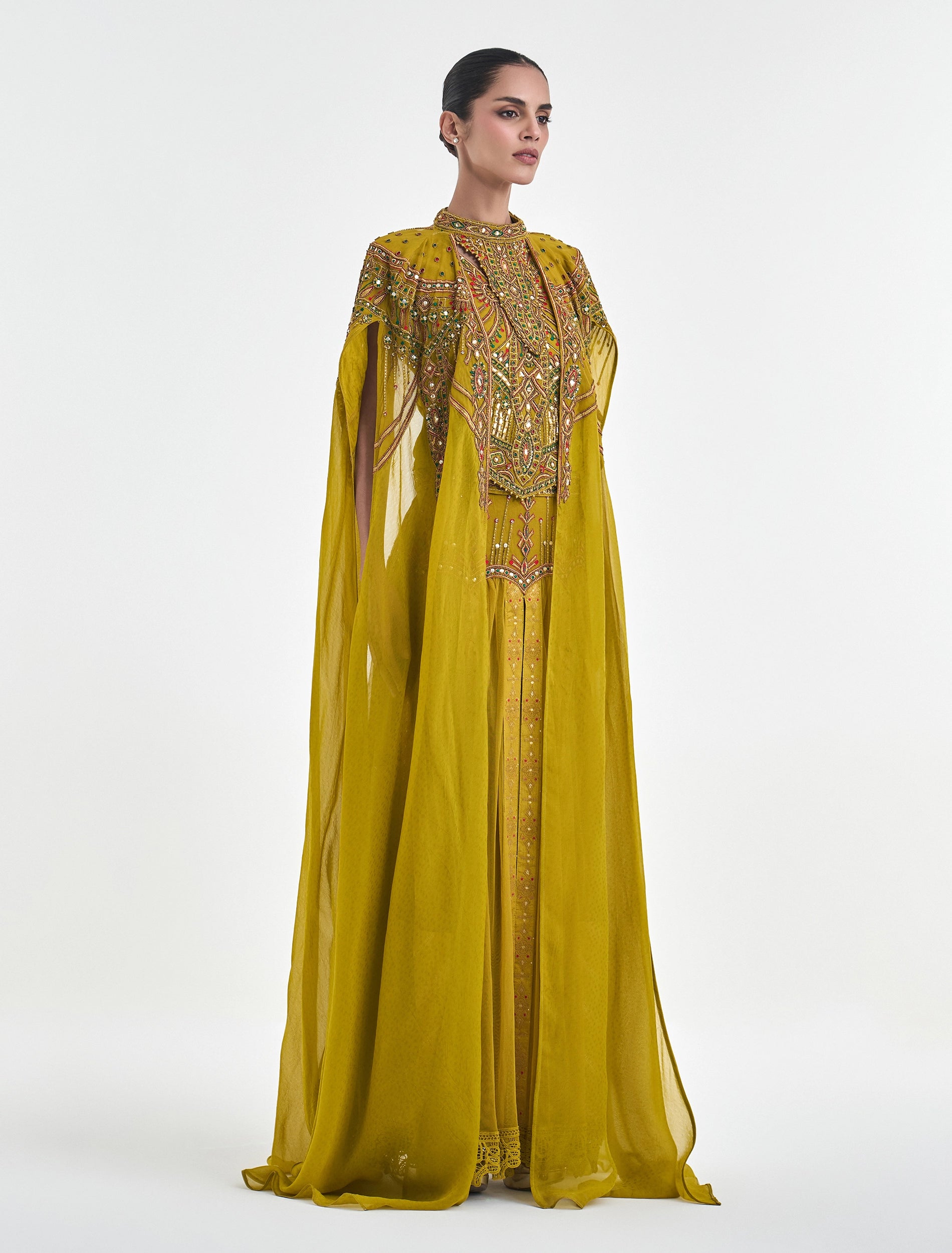فستان اصفر كموني مع اكمام كيب من التل المطرز
Mustard dress with embroidered tulle cape sleeves