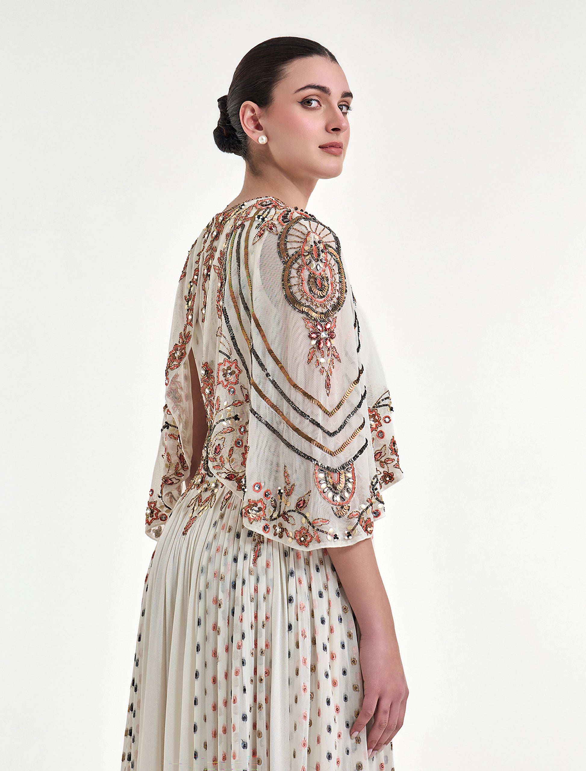 An off-white dress with hand embroidery