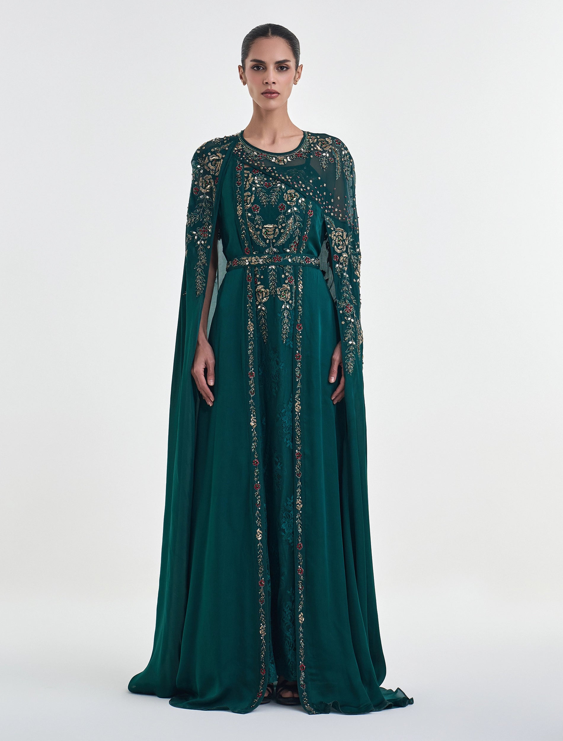 Emerald green dress with a royal cape