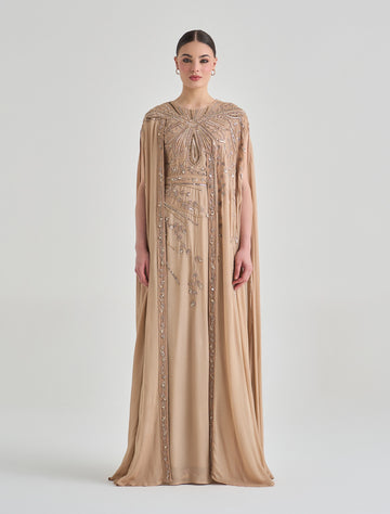 فستان سهرة ذهبي مطرز بقصة كاب انسيابية