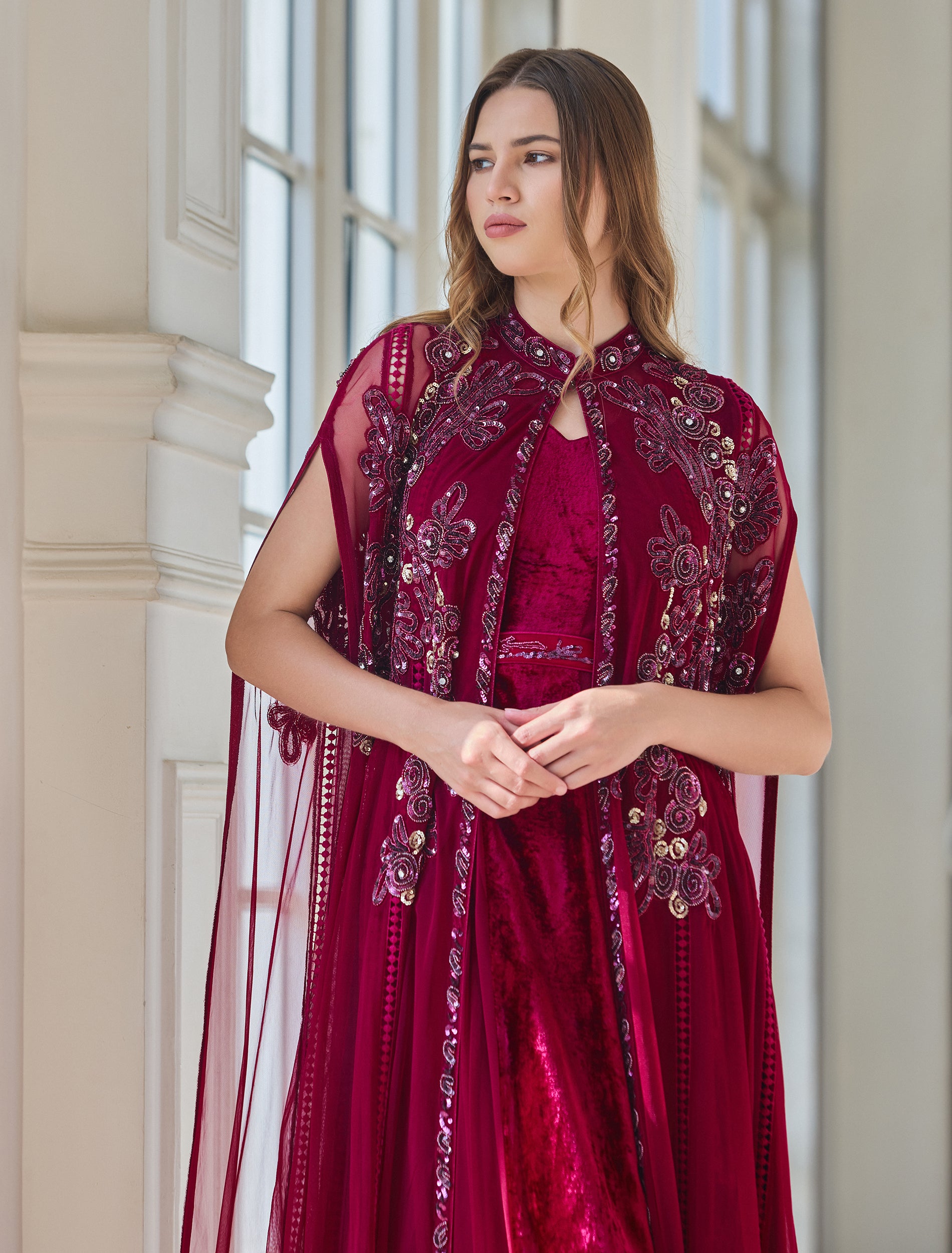 Floral dress in fuchsia with long cape sleeves Floral dress in fuchsia with long cape sleeves