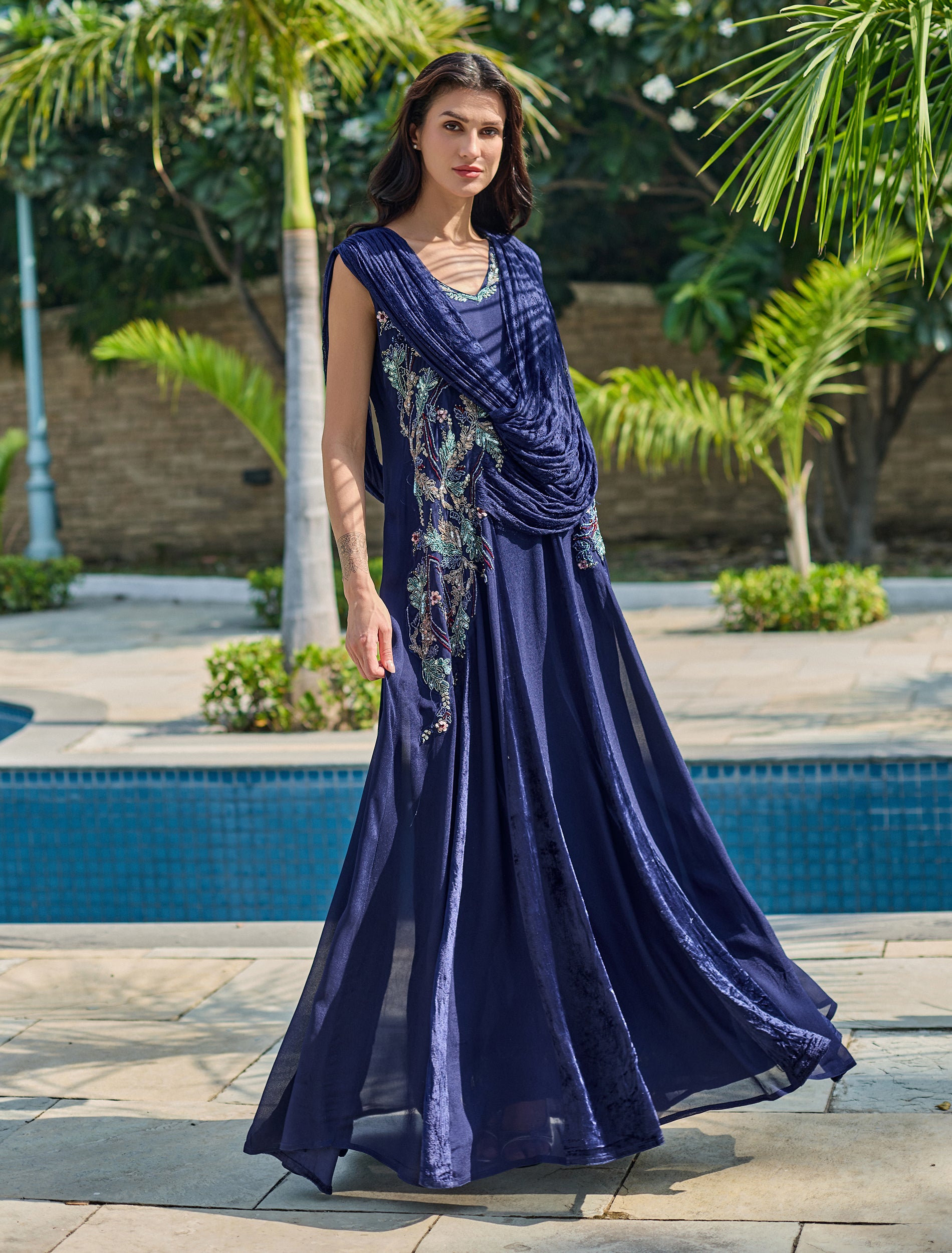 Navy blue dress with a draped waist and a royal design