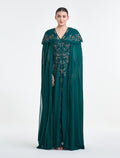 فستان لون اخضر غامق سهرة بكاب مطرز من شالكي.
dark green dress with embroidered caepe from Shalky