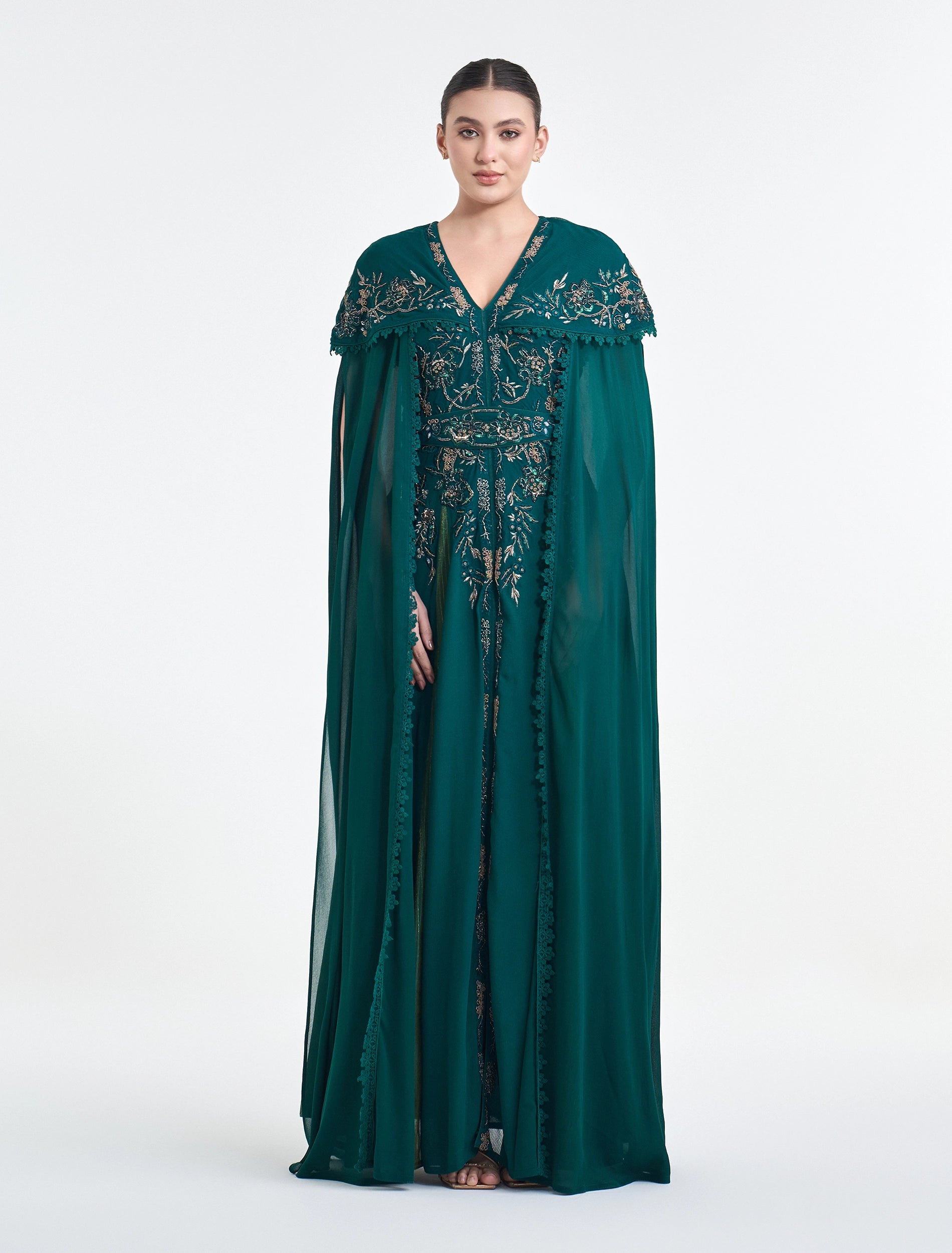 فستان لون اخضر غامق سهرة بكاب مطرز من شالكي.
dark green dress with embroidered caepe from Shalky